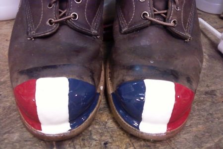 Red White and Blue patriotic Tuff Toe shown applied to toes of work boots for protection.