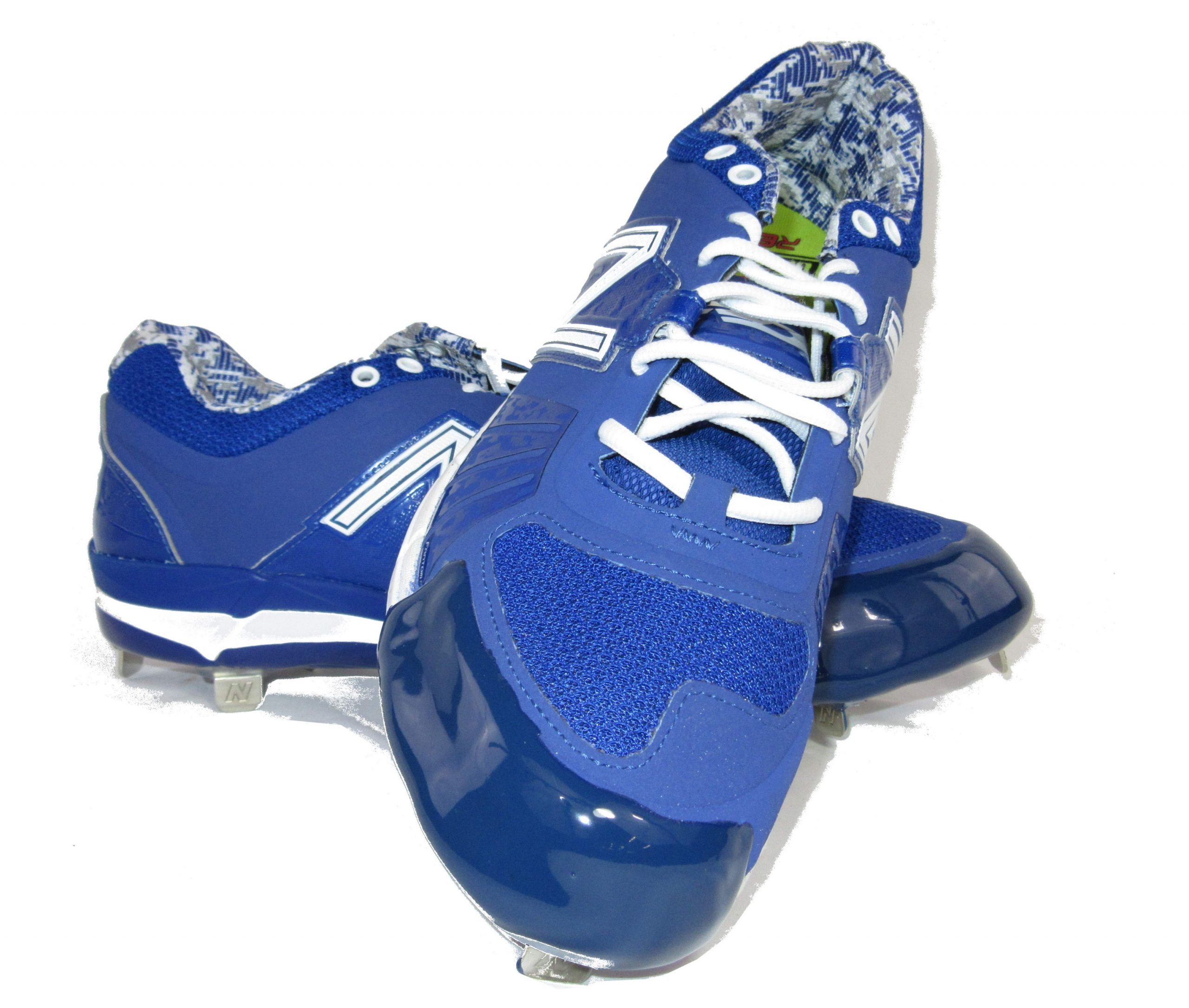 Tuff Toe shown applied to blue New Balance cleat to prevent drag toe and triple the lifespan.